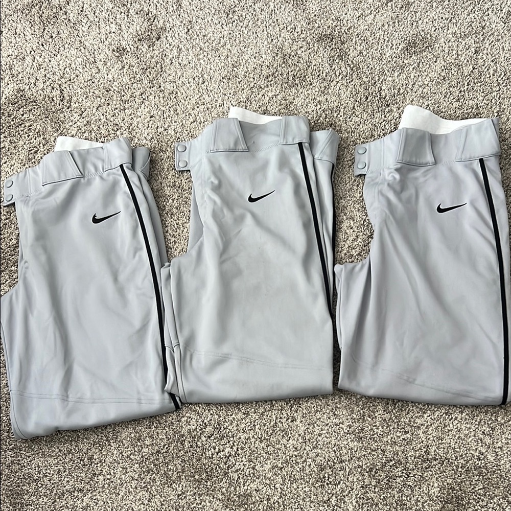 3-  Nike Light Gray Baseball Pants with black piping.